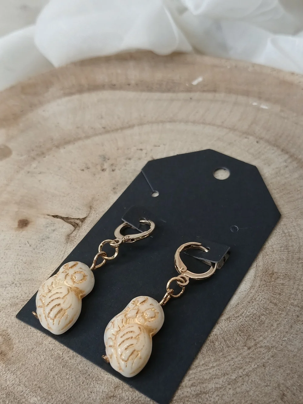 Gold Hoop Earrings with Cream Carved Bead Charms